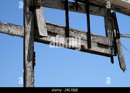 Looking out the window of an abandoned building in Lisbon, Portugal, during a sunny day Stock Photo