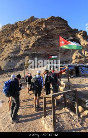 Walkers in the landscape of the Beidha valley before Little Petra, Al-Sharat area of Jordan, Middle East Stock Photo