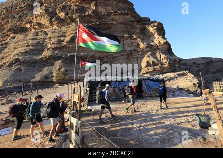 Walkers in the landscape of the Beidha valley before Little Petra, Al-Sharat area of Jordan, Middle East Stock Photo