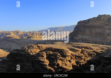 Walkers in the landscape of the Beidha valley before Little Petra, Al-Sharat area of Jordan, Middle East Stock Photo