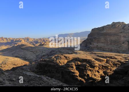 Walkers in the landscape of the Beidha valley before Little Petra, Al-Sharat area of Jordan, Middle East Stock Photo