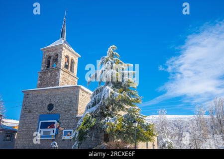 Church in winter. Somosierra, Madrid province, Spain. Stock Photo