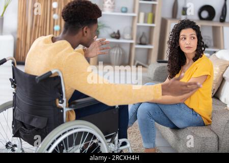 disable man and woman having argument at home Stock Photo