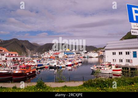 Honningsvåg harbour northern most city in mainland Norway Europe on lovely July day with moored fishing boats both inland and deep sea fishing vessels Stock Photo