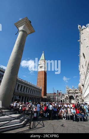 VENICE, ITALY - SEPTEMBER 16, 2009: Tourists visit Saint Mark's Square (Piazza San Marco) in Venice, Italy. Venice Old Town is a UNESCO World Heritage Stock Photo