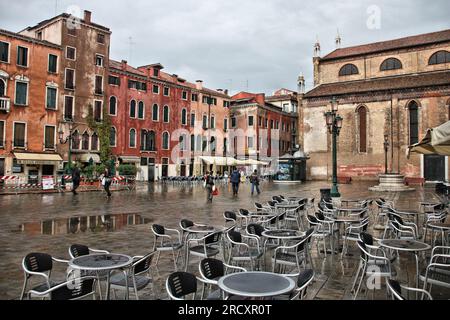 VENICE, ITALY - SEPTEMBER 16, 2009: People visit rainy Venice, Italy. Venice Old Town is a UNESCO World Heritage Site. Stock Photo