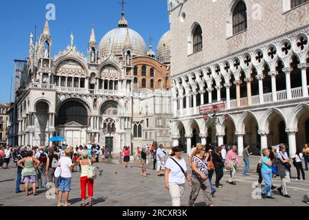 VENICE, ITALY - SEPTEMBER 16, 2009: Tourists visit Saint Mark's square, Venice, Italy. Approximately 20 million tourists visit Venice every year. Stock Photo