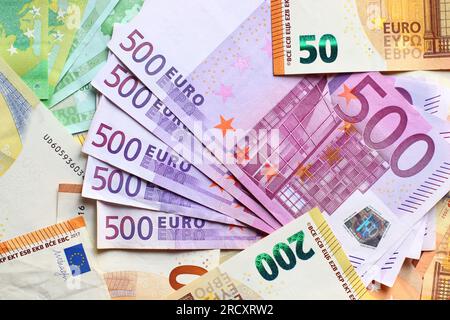 Euro currency banknotes background. European paper money backdrop with 100, 200 and 500 euros bills. Stock Photo