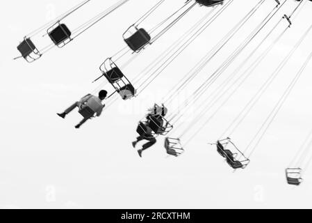 Group of people enjoying a ride on the chairlifts at the amusement park at Navy Pier in Chicago, Illinois, USA Stock Photo