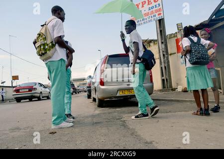 High school students looking for a taxi after school, October 27, 2012 in Libreville Stock Photo