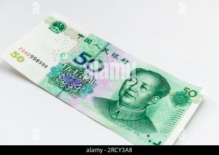 A Chinese 50 Yuan bank note isolated in white. Stock Photo