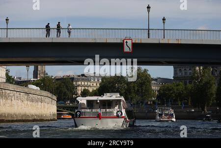 Paris, France. 17th July, 2023. Photo taken on July 17, 2023 shows the parade on the River Seine to test 'maneuvers', 'distances', 'duration' and 'video capture' of the future opening ceremony of the Paris Olympics in 2024. The total fleet is made up of 57 boats for the rehearsal, 39 representing the delegations and 18 others providing support as well as Olympic Broadcasting Services (OBS). Credit: Gao Jing/Xinhua/Alamy Live News Stock Photo