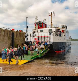 Fionnphort, Isle of Mull, Scotland UK.  6 June 2023.  Foot passengers disembark an inter island ferry from the Isle of Iona Stock Photo