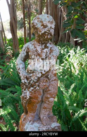 Erosion of a boy stone statue in the garden at John and Mable Ringling Museum, Sarasota, Florida. Stock Photo