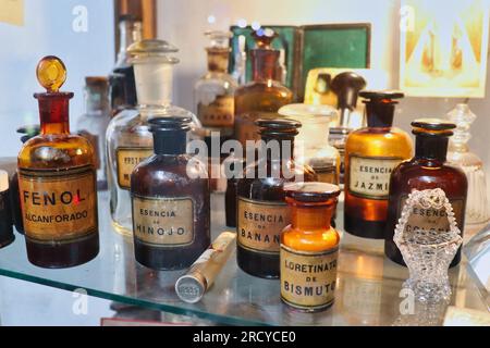 old pharmacy and perfumery bottles of medicines and fruit essences Stock Photo