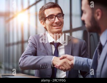 Two diverse business men analysts partners talking, working together Stock Photo