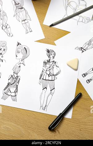 The artist draws on paper characters for computer games or comics Stock ...