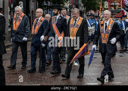 A group of Orangemen march through Belfast City centre as part of the annual July 12th parade season. July marks the annual loyalist marching season as practiced by the Protestant unionist communities of Northern Ireland in commemoration of a centuries-old military victory of Protestant King William of Orange over Catholic King James the second. The season culminates with a day of parades throughout the North on the 12th of July following the Eleventh Night bonfire celebrations the previous night. (Photo by Graham Martin/SOPA Images/Sipa USA) Stock Photo