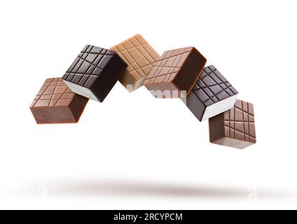 Assorted chocolate pralines floating on white background Stock Photo