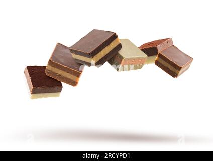 Assorted chocolate pralines floating on white background Stock Photo