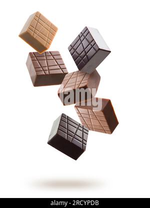 Assorted chocolate pralines floating on white background Stock Photo