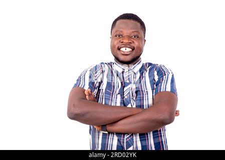 portrait of a handsome confident young man crossing his arms while smiling. Stock Photo