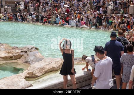 Rome, Italy. 17th July, 2023. Tourists in front of Trevi Fountain in Rome on a hot summer day (Credit Image: © Matteo Nardone/Pacific Press via ZUMA Press Wire) EDITORIAL USAGE ONLY! Not for Commercial USAGE! Stock Photo