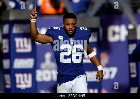 New York Giants running back Saquon Barkley (26) runs with the ball against  the Washington Commanders during an NFL football game Sunday, Dec. 4, 2022,  in East Rutherford, N.J. (AP Photo/Adam Hunger