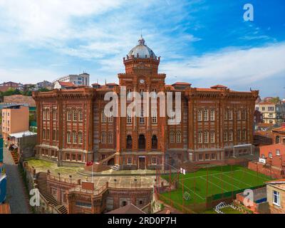 Balat district street view in Istanbul.  Dome of Fener Greek Orthodox School and minaret, in Fener, Istanbul, Turkey Stock Photo