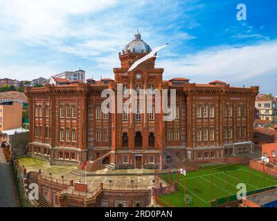 Balat district street view in Istanbul.  Dome of Fener Greek Orthodox School and minaret, in Fener, Istanbul, Turkey Stock Photo