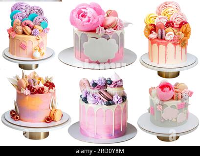 Various pink cakes isolated on white background. Cakes with raspberry, edible flowers, marshmallow, lollipops, chocolate, meringues and macarons Stock Photo