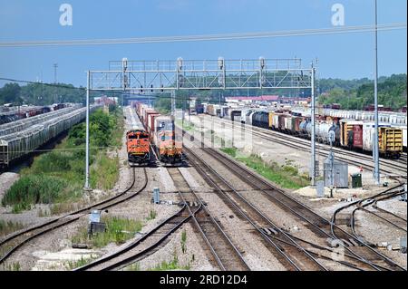 Aurora, Illinois, USA. Burlington Northern Santa Fe locomotives exiting a railroad freight yard in Illinois. Stock Photo