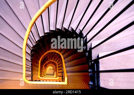 Looking down a spiral staircase Stock Photo