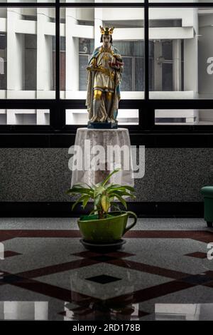 Bangkok, Thailand - 16 Jul, 2023 - Statue of king of France St. Louis lX on the platform in front of the glass wall. Representative of the Capetian Dy Stock Photo