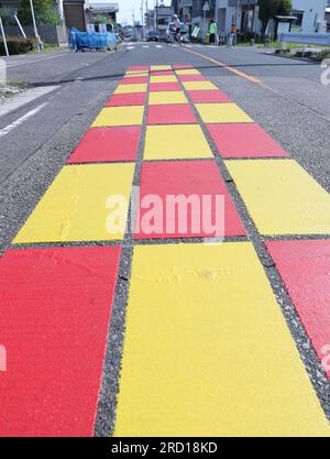 A new type of road sign is installed just this side a pedestrian ...