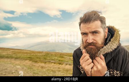 bearded man having moustache, banner. photo of bearded man in the mountain. Stock Photo