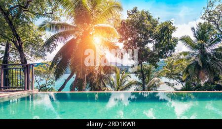 Beautiful luxury outdoor swimming pool in hotel resort. Stock Photo