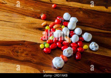 Tomatoes and mushrooms on a natural wood table Stock Photo