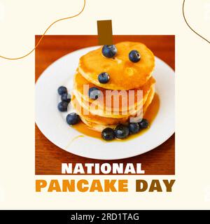 National pancake day text in white and brown with pancake stack on plate with blueberries and syrup Stock Photo