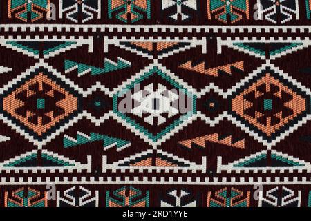 Traditional Turkish carpet and kilim motifs. There are geometric motifs on a black background. Stock Photo
