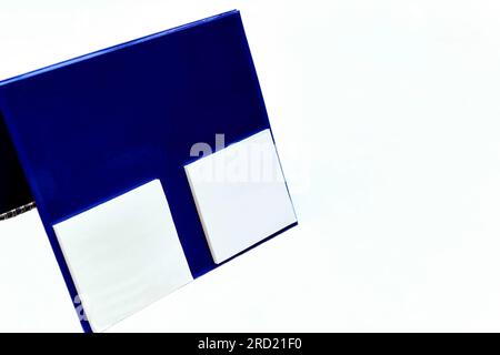 Empty blue diary calendar with tear off sheets of paper for notes, message, chit Stock Photo