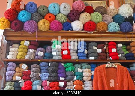 Balls of knitting wool, in a shop in Filey, North Yorkshire, England, UK, Stock Photo