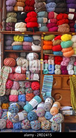 Balls of knitting wool, in a shop in Filey, North Yorkshire, England, UK, Stock Photo