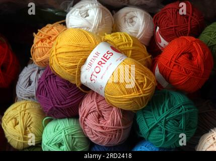 Balls of knitting wool, in a shop in Filey, North Yorkshire, England, UK, Stock Photo