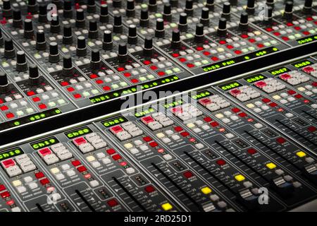 Mixing console or mixing desk. Audio sound mixer table in a recording studio. Stock Photo