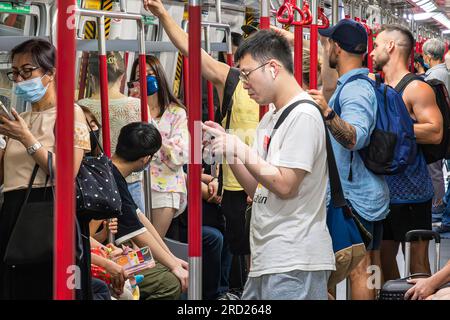 Passengers on MTR rapid transit train, Hong Kong, SAR, China Stock Photo