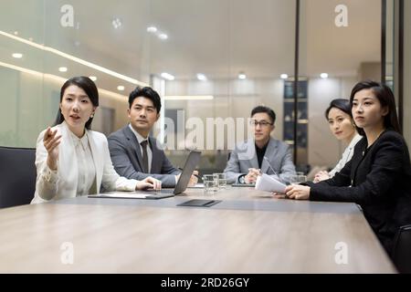 Confident Chinese business people having a meeting Stock Photo