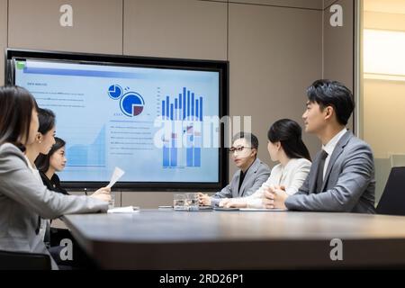 Confident Chinese business people having a meeting Stock Photo