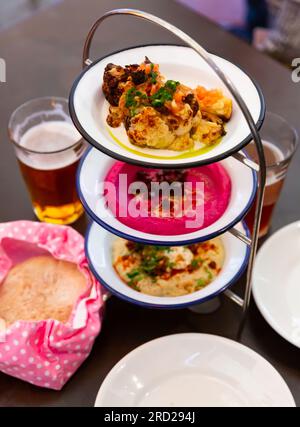 Different types of meze dishes served on table Stock Photo