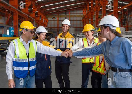 Group of construction workers clad in hard hats and reflective vests ...